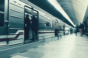 metro station, Prague, subway train, underground transportation, urban transit, public transport, city life, modern infrastructure, commuter travel, station platform, train doors