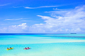 Malediven, Paar, Reise, Flitterwochen, Hochzeit, Urlaub, Kanu, Strand, Lagune, Ozean, Himmel