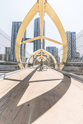 bicycle rider, standing, bike, modern, bridge, city., city, pedestrian, cyclist, bicycle, walkway