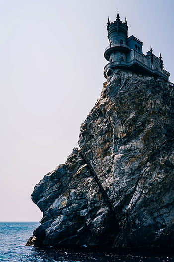 rock, formation, building, architecture, sky, sea, ocean, water, coast, hill, castle
