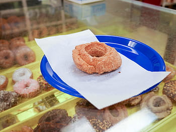 cinnamon cake donut, sitting, blue, plate, inside, shop., bakery, breakfast, calories, chocolate, colorful