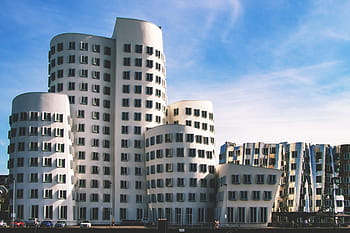 Dusseldorf buildings, modern architecture, futuristic design, urban skyline, contemporary structures, cityscape view, architectural marvel, unique building shapes, Dusseldorf city, innovative design, landmark buildings