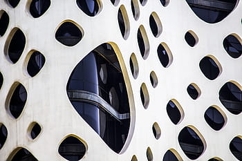 Dubai architecture, modern architecture, architectural design, building facade, circular windows, urban design, contemporary building, exterior design, architectural photography, innovative architecture, cityscape architecture
