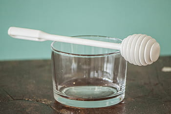 glass cup, plastic honey dipper, honey, dipper, transparent, beaker, experiment, laboratory, chemical, chemistry, science