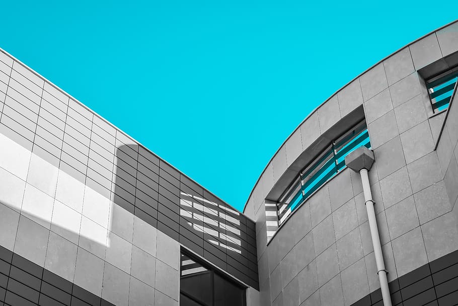 architectural feature, architecture, building, building exterior, built structure, ceiling, city, day, directly below, glass, material