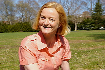 woman, middle-aged, mischievous, happy