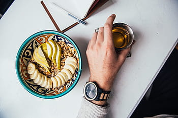 tea mug, held, male, hand, granola, plate, table, beverage, drink, meal, breakfast