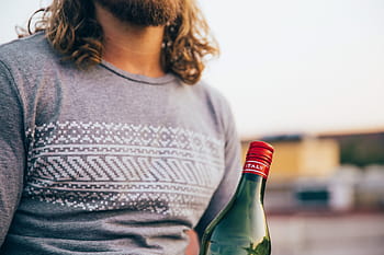 bearded, caucasian man, wearing, t-shirt, holding, italian bottle, 25-30 year old, alcohol, bar, bottle, celebrating