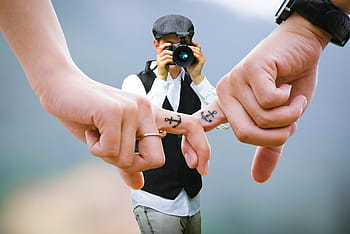 couple, holding, hands, photographer, takes, photo., matching, finger tattoos, tattoos., love, together