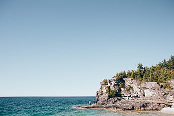 young, hikers, rock, bay, turquoise, blue, ocean, adventure, coast, horizon, island